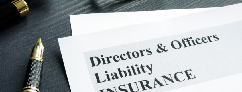 piece of paper on desk with pen that reads "directors & officers liability INSURANCE"