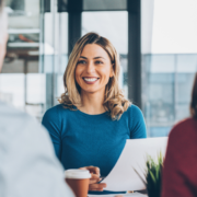 smiling woman having a meeting with another man and woman